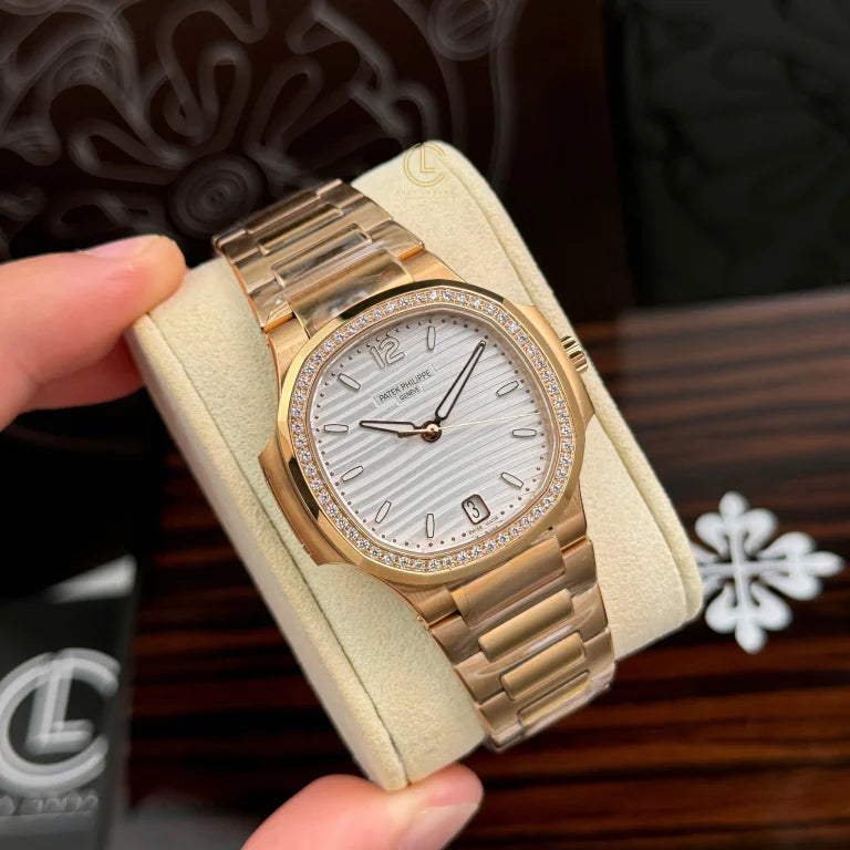 Patek Philippe Nautilus 7118/1R-011 32.5mm White Dial Rose Gold